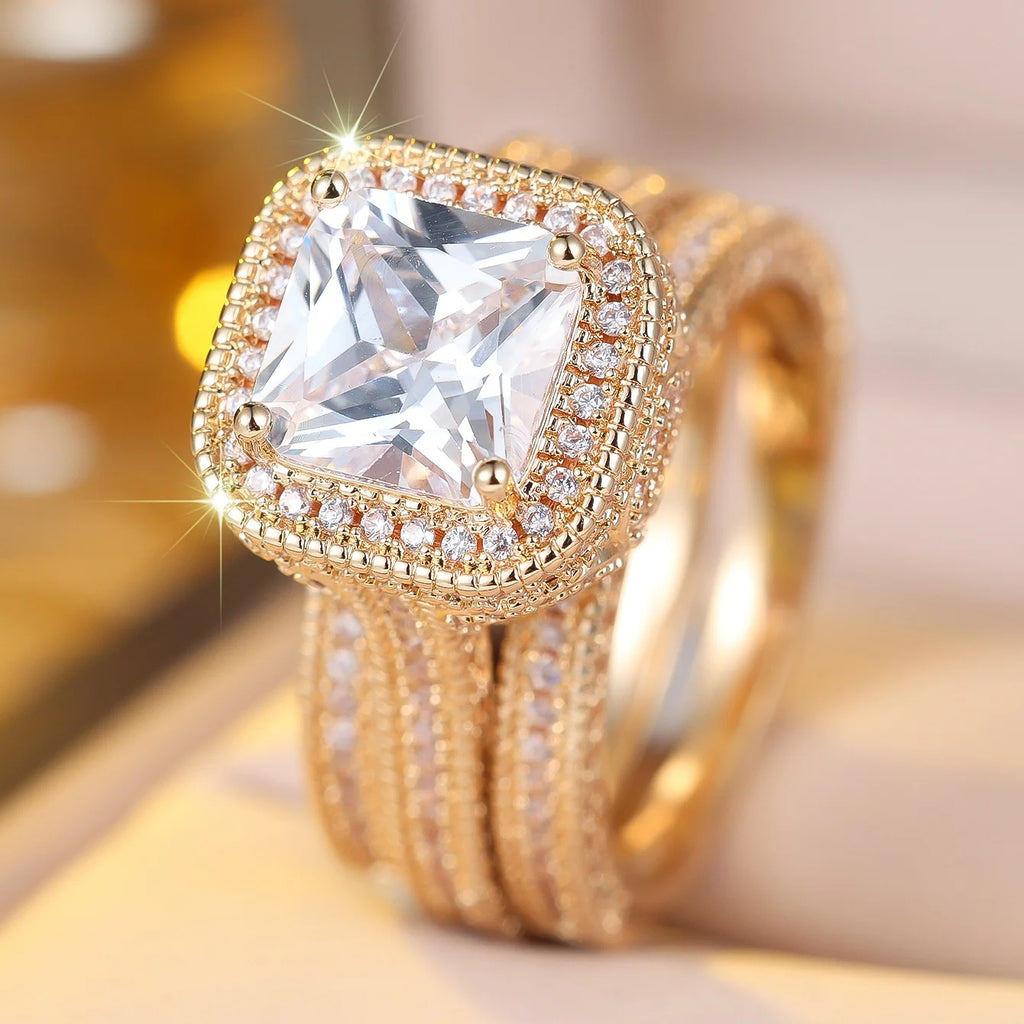 Anel ZENORY Lumière Royale — Zircônia Quadrada com Halo Dourado